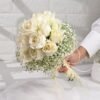 White Roses Radiance Bouquet – a stunning bouquet of pristine white roses, ideal for conveying purity, love, and timeless elegance.