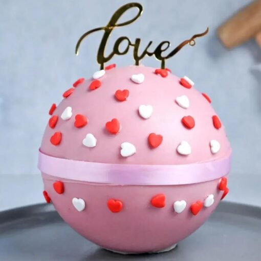 Love Velvet Pinata Cake with a heart-shaped design, featuring red velvet flavors and hidden surprises, ideal for romantic occasions.