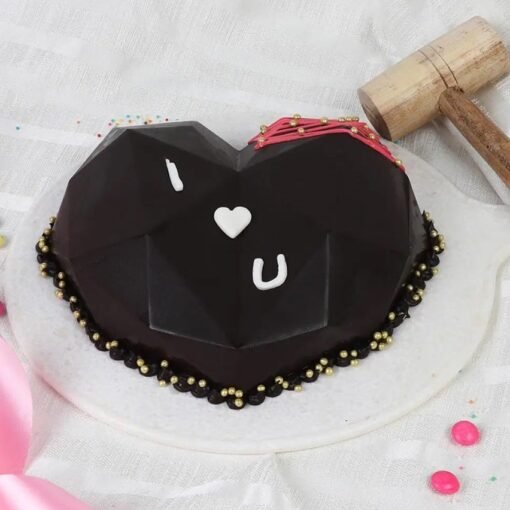 Romantic Cravings Pinata Cake, heart-shaped smash cake with a glossy finish, perfect for romantic celebrations and surprise-filled indulgences.