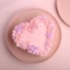 Blushing Floral Heart Cake – A beautifully crafted heart-shaped cake adorned with delicate flowers, perfect for romantic celebrations and special occasions.