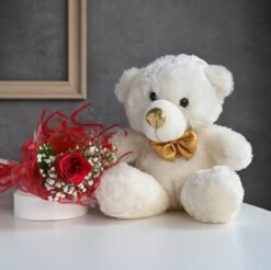 Adorable teddy bear with a bouquet of fresh roses—Cute Cuddles & Rosy Blooms, the perfect gift for your loved ones.