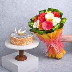 Bright gerberas bouquet with a scrumptious cake, an ideal gift for birthdays, anniversaries, and special celebrations.