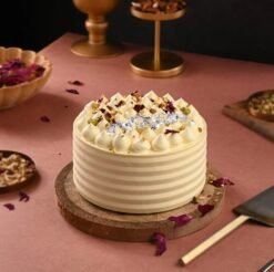 Festive Holi Thandai Cake infused with saffron, cardamom, and nuts, capturing the essence of Holi celebrations.