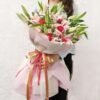 Lush Lily Symphony bouquet featuring fresh, vibrant lilies elegantly arranged for a timeless floral gift.