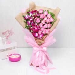 Elegant Mystic Roses 'N' Orchid Bloom featuring fresh roses and orchids, a perfect floral arrangement for celebrations and heartfelt gifts.