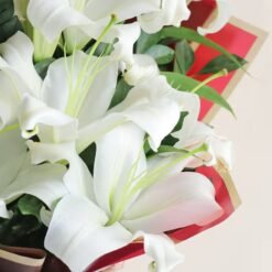 Opulent Lily Radiance bouquet – a luxurious arrangement of fresh lilies, perfect for celebrations, romantic gestures, and special moments.