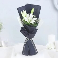 Pearl Lily Arrangement – A stunning bouquet of fresh white lilies, radiating elegance and tranquility.