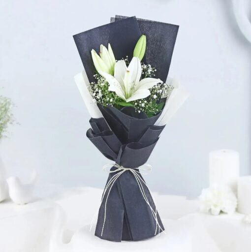 Pearl Lily Arrangement – A stunning bouquet of fresh white lilies, radiating elegance and tranquility.