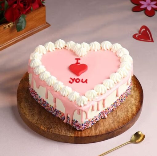 Pink Blossom Heart Cake – A beautifully designed heart-shaped cake adorned with pink floral accents, perfect for romantic celebrations and special occasions.