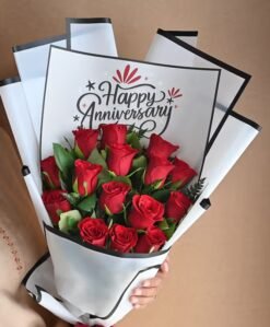 Elegant Scarlet Bliss Anniversary Blooms with fresh red roses, perfect for celebrating anniversaries and special romantic occasions.