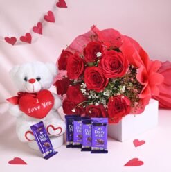 Sweet Embrace Gift Set – A perfect combination of a soft teddy bear, delicious chocolates, and fresh flowers, ideal for special occasions.