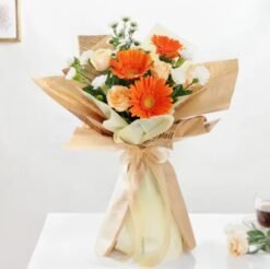 Bright and cheerful Tangerine Bliss Floral Mix with fresh orange-hued flowers, ideal for gifting on birthdays, anniversaries, or celebrations.