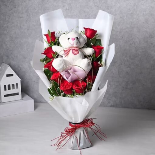 Teddy's Rosy Bouquet featuring fresh roses and a soft teddy bear, a perfect gift for love, birthdays, or anniversaries.