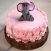 Beautiful Baby Elephant Rose Cake with pastel hues, intricate floral designs, and a cute fondant elephant topper, ideal for special occasions.