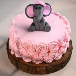 Beautiful Baby Elephant Rose Cake with pastel hues, intricate floral designs, and a cute fondant elephant topper, ideal for special occasions.