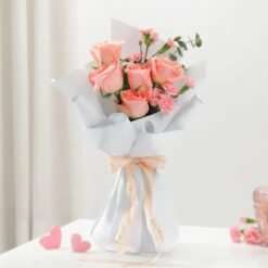 A breathtaking floral arrangement featuring a mix of radiant, fresh blooms, symbolizing love, passion, and heartfelt emotions for special moments.