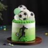 Champion Soccer Cake decorated with a football field, edible soccer ball, and goalpost, ideal for sports enthusiasts and birthday celebrations.