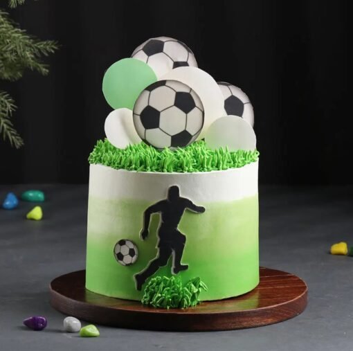 Champion Soccer Cake decorated with a football field, edible soccer ball, and goalpost, ideal for sports enthusiasts and birthday celebrations.