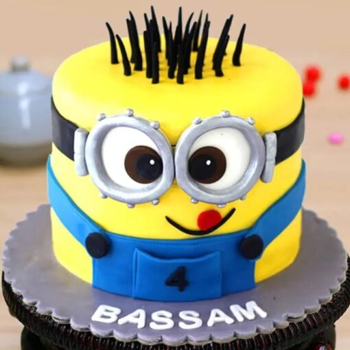 Adorable Minion-themed cake with vibrant yellow design, perfect for birthdays and celebrations.