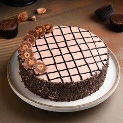 Dark Desire Ferrero Rocher Cake with rich chocolate layers, hazelnut crunch, and Ferrero Rocher toppings for a luxurious treat.