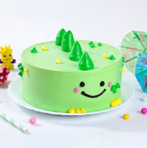 Vibrant Dino Cake featuring colorful dinosaur decorations, lush green frosting, and prehistoric-themed edible details for a fun celebration.