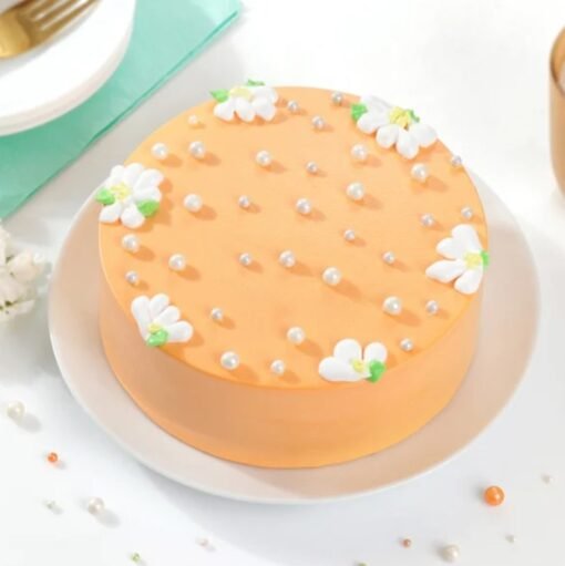 Floral Peachy Cake – a pastel peach cake decorated with elegant floral designs, perfect for birthdays, weddings, and celebrations.