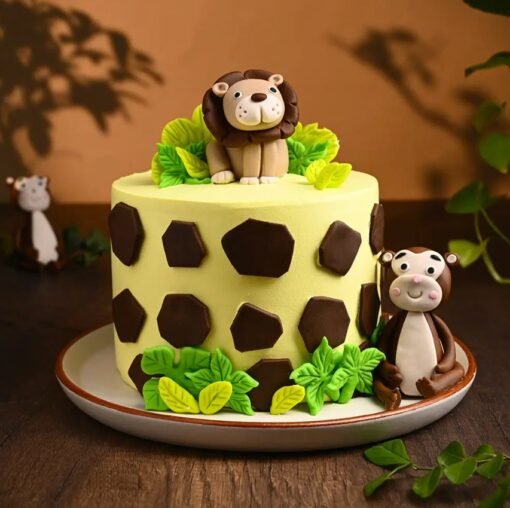 Majestic Lion The Jungle King Cake with a fondant lion, jungle greenery, and edible decorations—perfect for jungle-themed birthdays and celebrations.