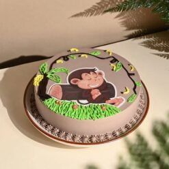 Adorable Mischief Monkey Cake featuring a cute fondant monkey, jungle-themed decorations, and creamy layers, perfect for kids' birthday celebrations.