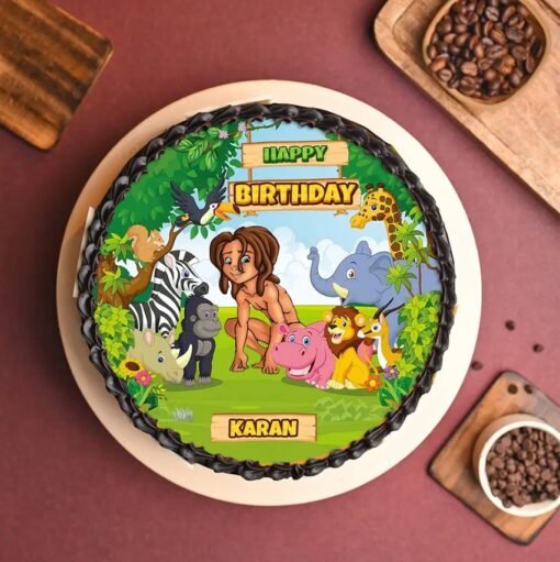 Jungle-themed Mowgli and Friends Cake with edible designs of Mowgli, Baloo, Bagheera, and vibrant forest elements.