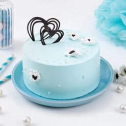 Pastel Blue Cream Cake – a light, airy sponge covered in smooth pastel blue frosting, perfect for elegant celebrations.