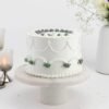 Snowy Delight Cake – a beautifully crafted white-themed cake with smooth frosting, perfect for winter celebrations and special occasions.