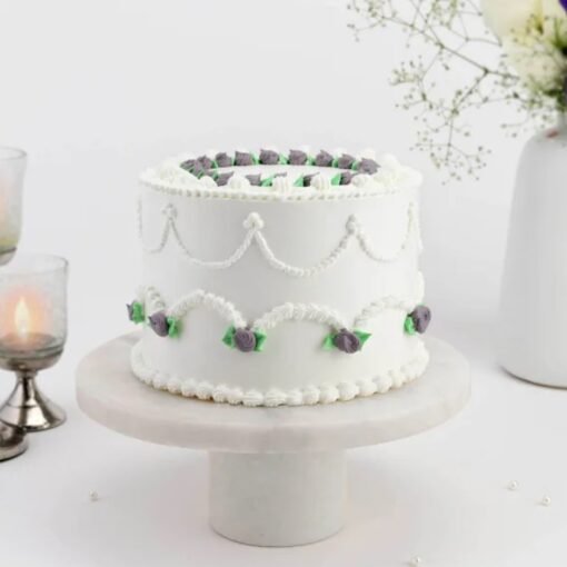 Snowy Delight Cake – a beautifully crafted white-themed cake with smooth frosting, perfect for winter celebrations and special occasions.