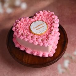 Sweet Success Heart Cake with elegant frosting, celebratory decorations, and a heart shape, perfect for achievements and special occasions.