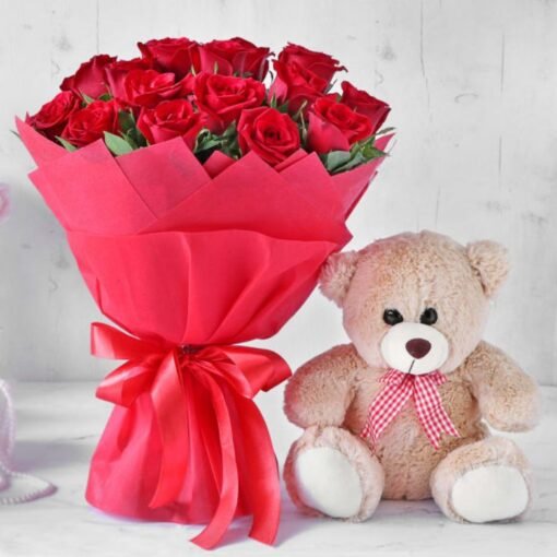 A romantic bouquet of fresh flowers paired with a soft teddy bear, making a perfect gift for special occasions and love-filled moments.