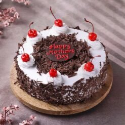 Black Forest Mother’s Day Cake — rich chocolate cake layered with cream and cherries, beautifully decorated for Mom’s special day.