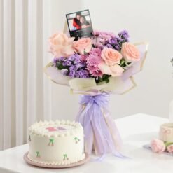 Charming Blooms And Cake For Her — vibrant floral arrangement paired with a delectable cake, designed for heartfelt celebrations and special occasions.