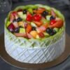 Fruit Delight Gateaux — layered sponge cake topped with fresh fruits and cream, ideal for fruit lovers.