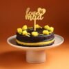 Love You Maa Chocolate Mango Cake — decadent chocolate cake layered with mango cream, topped with fresh mangoes and a “Love You Maa” message.