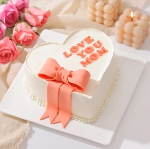 Mom's Heartful Delight Cake — elegant heart-themed cake with delicate decorations, made to honor moms with love and sweetness.