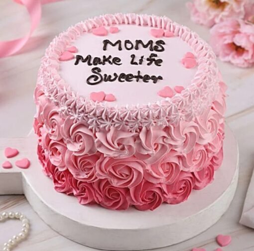 Mother’s Day Sweet Cream Cake — elegant cream-frosted cake adorned with pastel decorations and a heartfelt message for Mom.