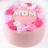 Pink Flowery Mom’s Day Cake — elegant pink cake adorned with floral decorations and a heartfelt “Happy Mother’s Day” message.