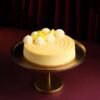 Golden Dream Mango Cheesecake with mango glaze and fresh mango slices on top.