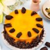Mango Silk Cake with glossy mango glaze and delicate cream layers.