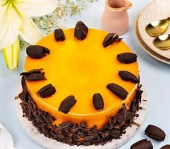 Mango Silk Cake with glossy mango glaze and delicate cream layers.