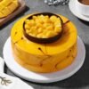 Sunshine Mango Treat Cake topped with fresh mango cubes and a golden glaze.