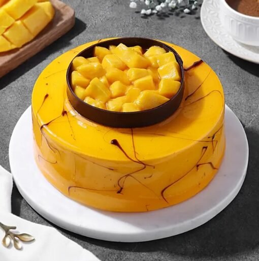 Sunshine Mango Treat Cake topped with fresh mango cubes and a golden glaze.