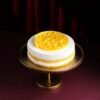 Tropical Velvet Mousse Cake with layers of vibrant mousse and tropical fruit toppings.